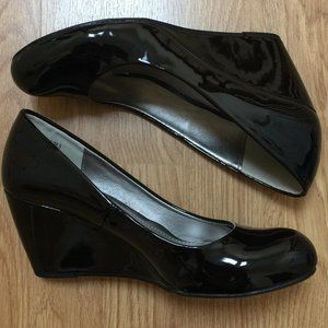 Black patent leather wedge pumps